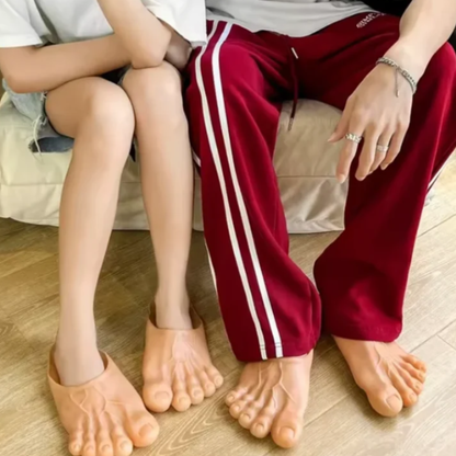 Two people wearing giant feet slippers