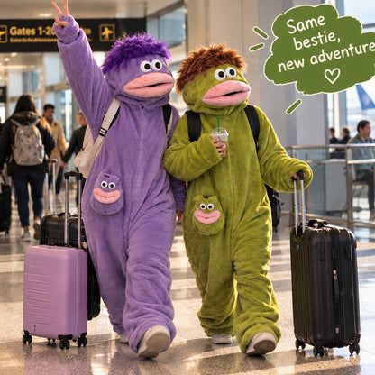 Two besties wearing Belly Buddy monster onesies at the airport