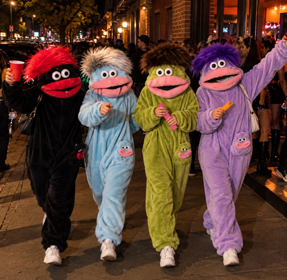 A squad in matching monster onesies on a night out