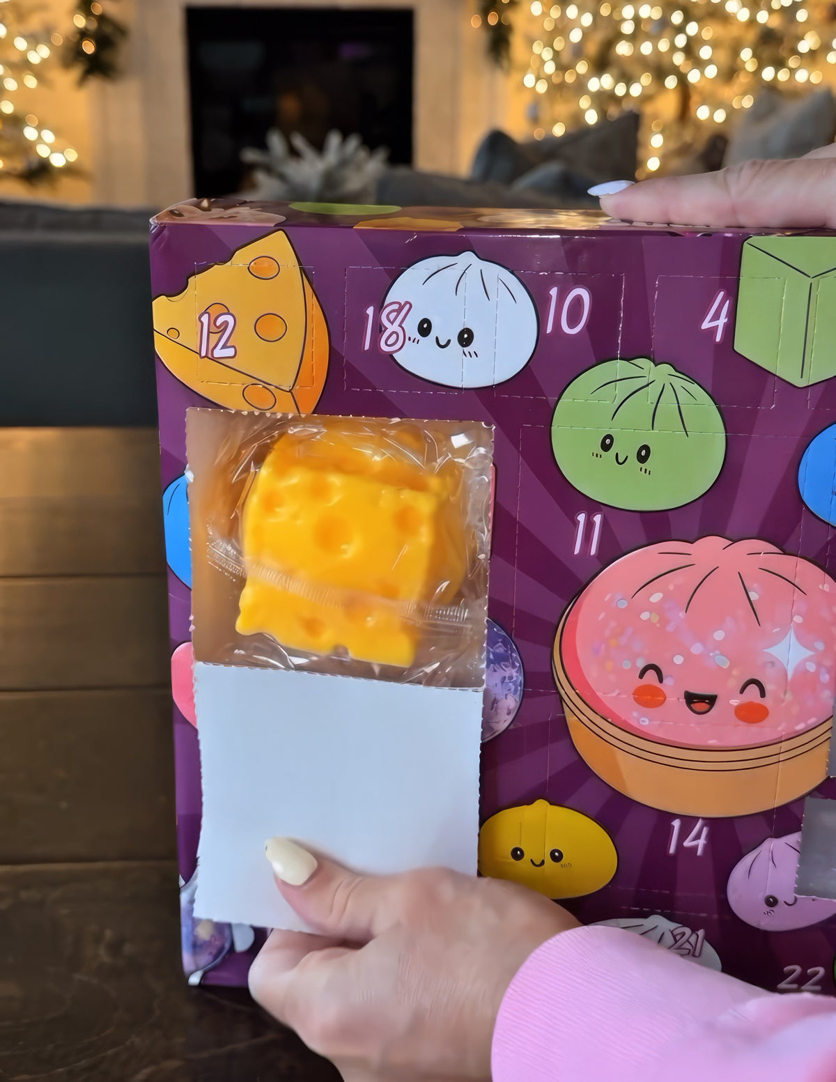 Opening a door on the Dumpling Days calendar to find a cheese squishy