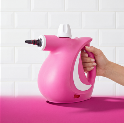 Hand holding the Grime Genie steam cleaner