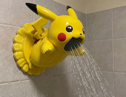 Pikachu Showerhead hanging on a shower arm