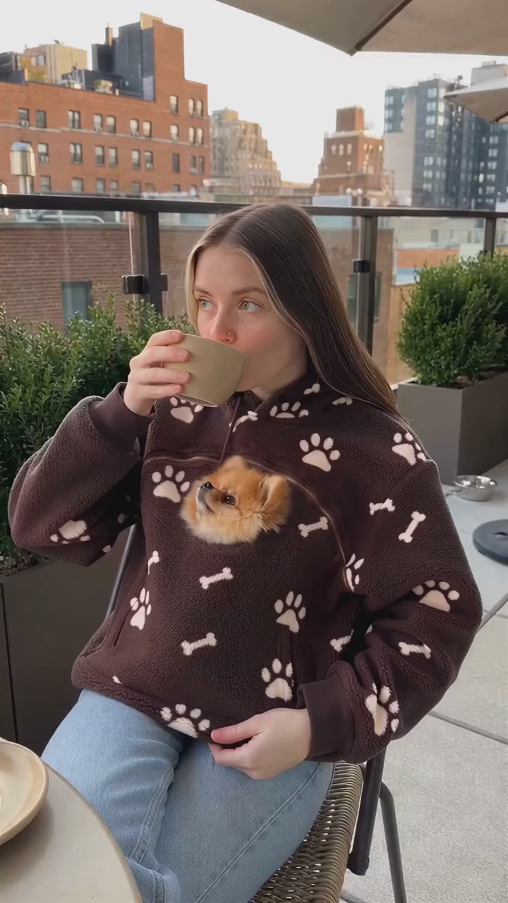 Dog riding in the hoodie pouch during a coffee run