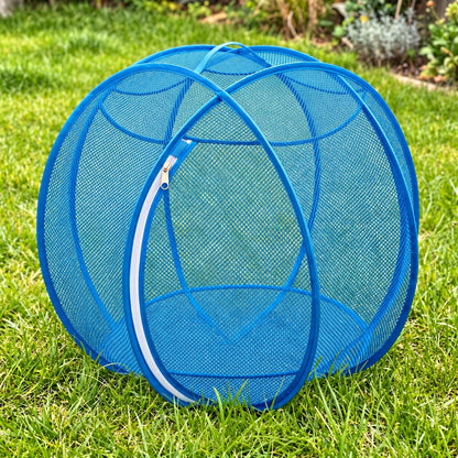 Pup Palace pop-up mesh pet playpen ball in Blue on the grass