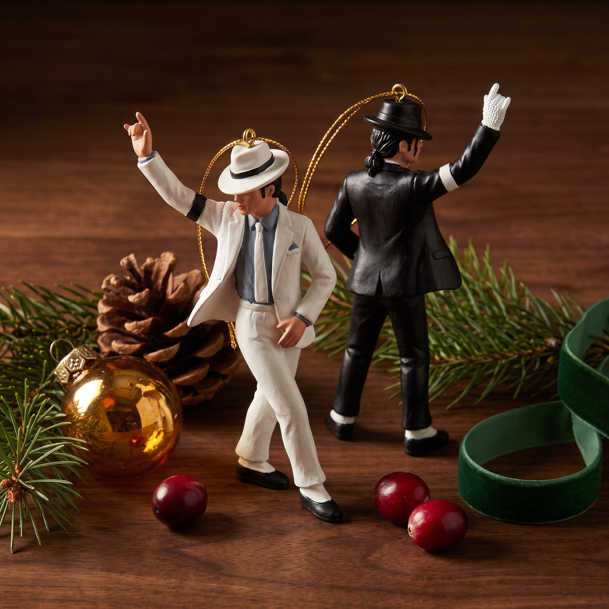 Two pop star figure ornaments in white and black stage suits