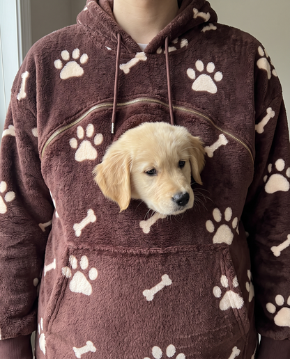 Puppy peeking out of the Touchdown Pup hoodie pouch porthole